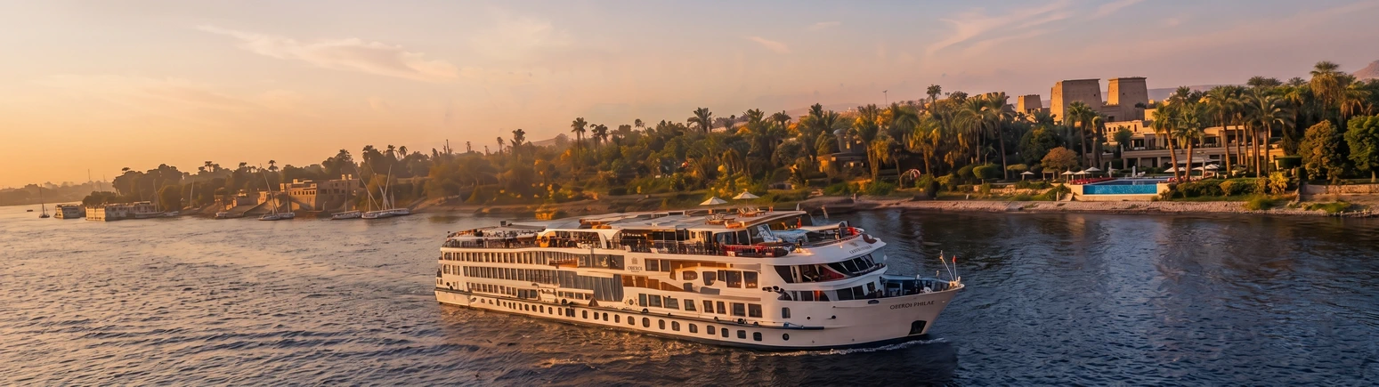 Nile cruise boat on the river at golden hour